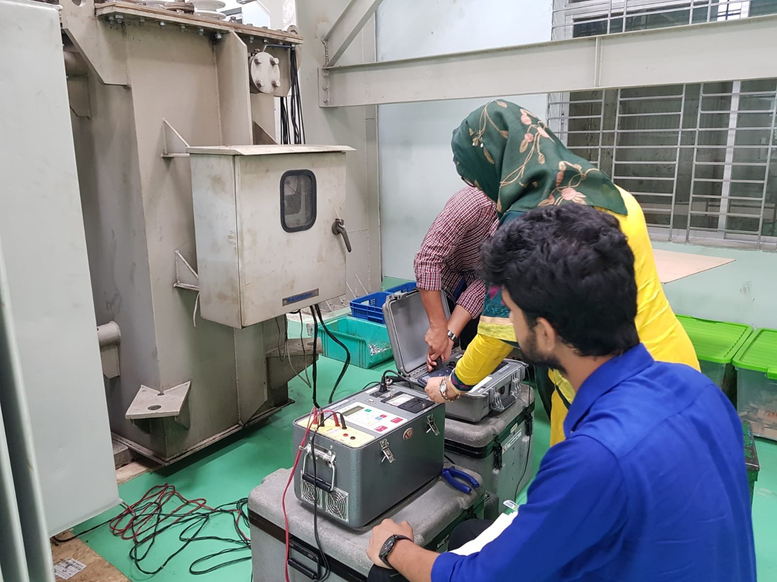 M2K engineers testing a distribution transformer with Vanguard instruments at Energypac